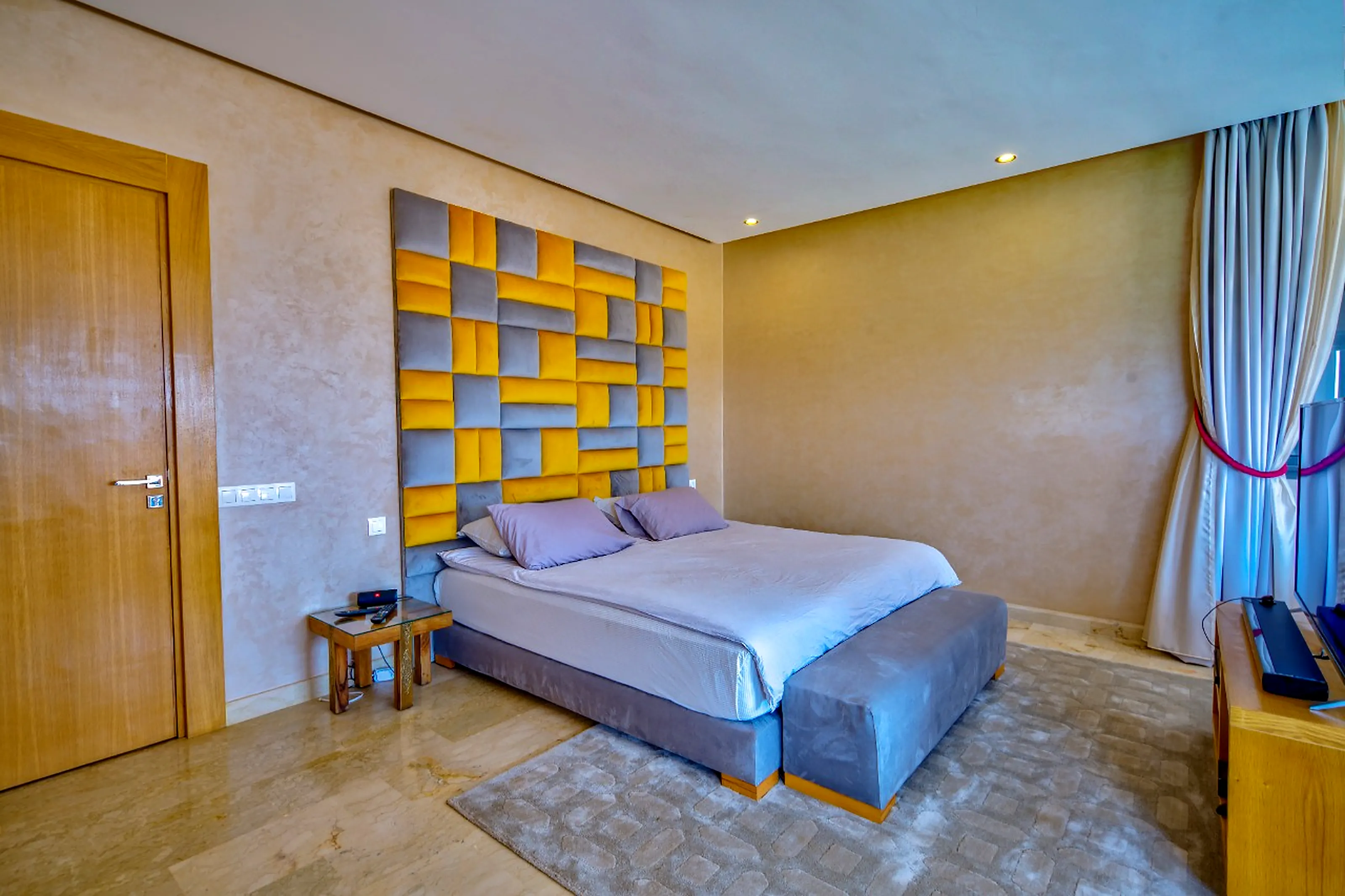 Premium HDR exterior view - Illuminated facade, emerald lawn and palm trees under Marrakech blue sky