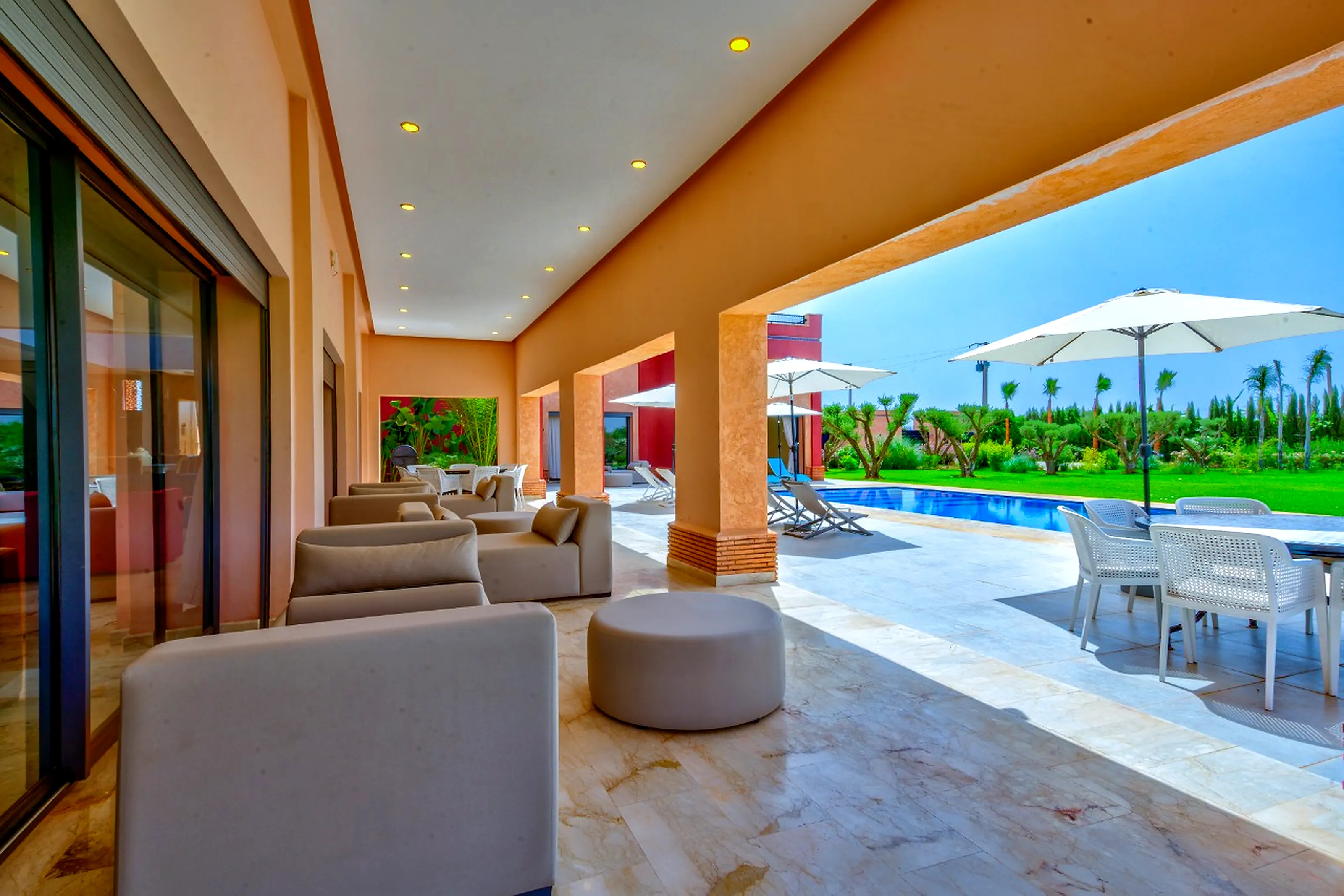 Minimalist modern lounge - Clean lines, sand & sky blue tones, central fireplace
